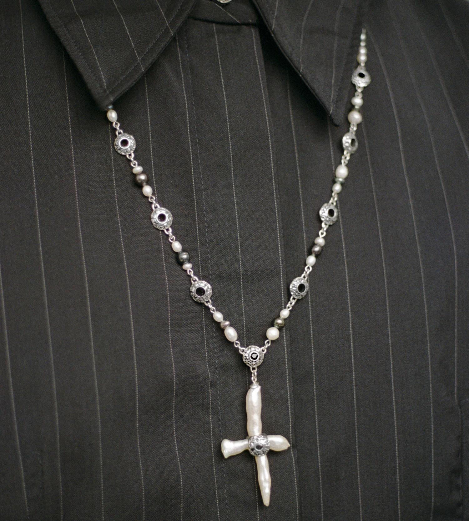 Freshwater cross pearl necklace with sterling silver and black sapphire accents.