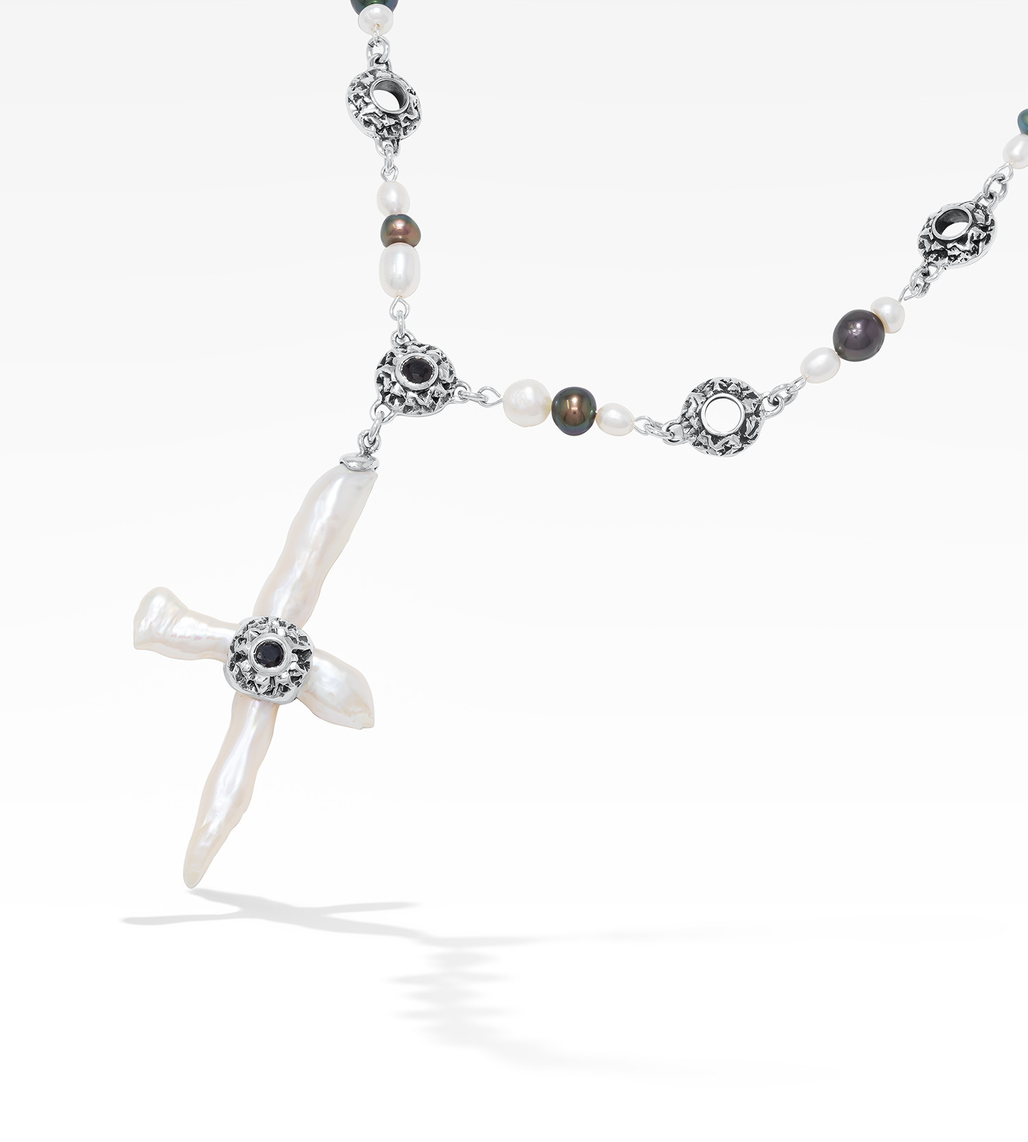 Freshwater cross pearl necklace with sterling silver and black sapphire accents.