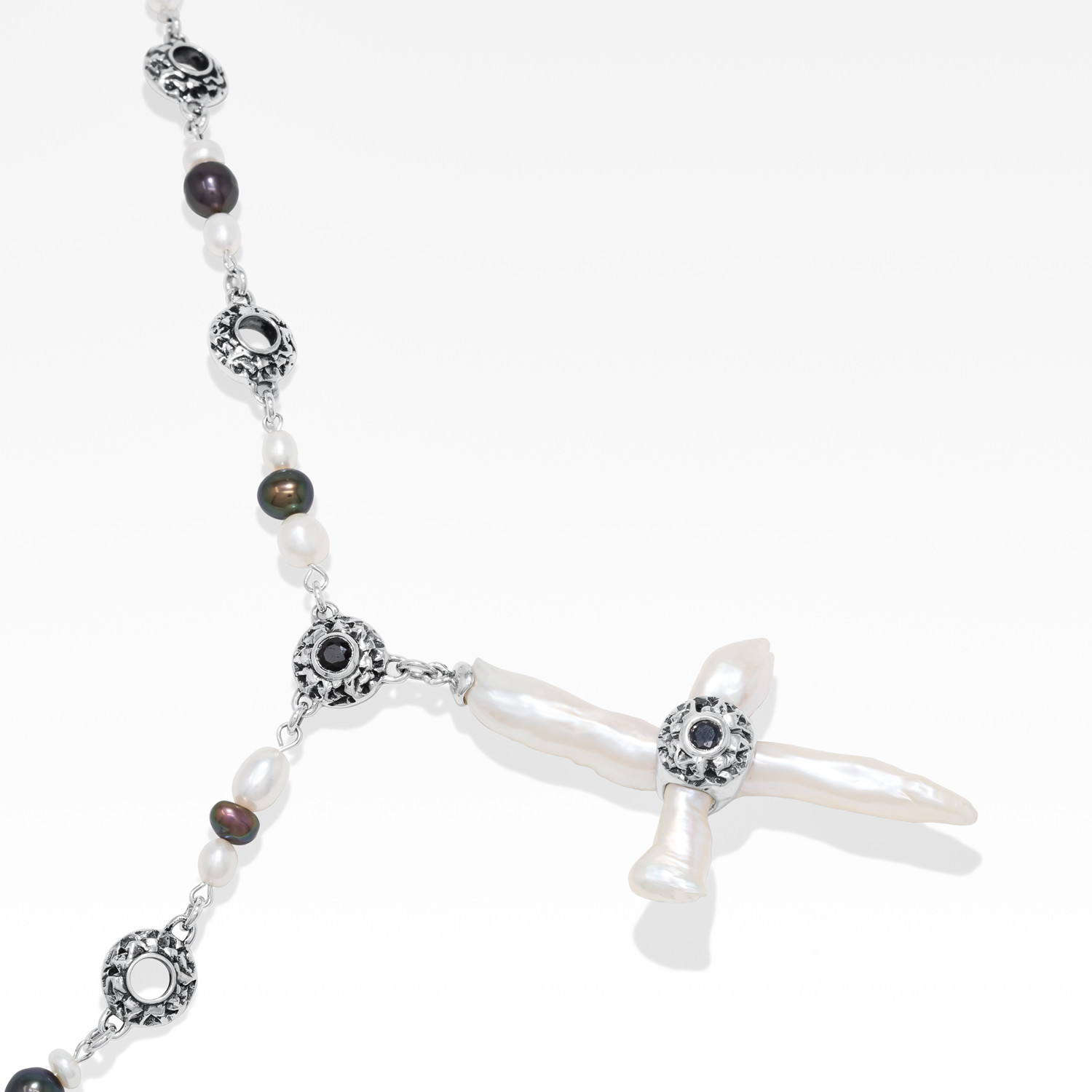 Freshwater cross pearl necklace with sterling silver and black sapphire accents.