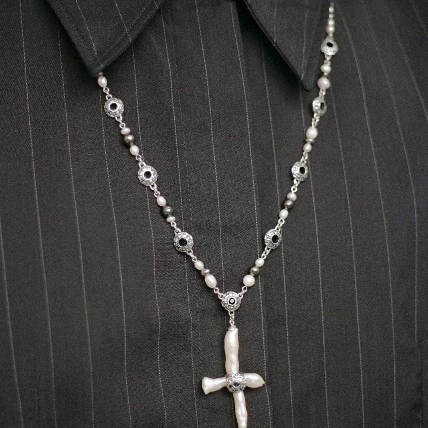 Freshwater cross pearl necklace with sterling silver and black sapphire accents.