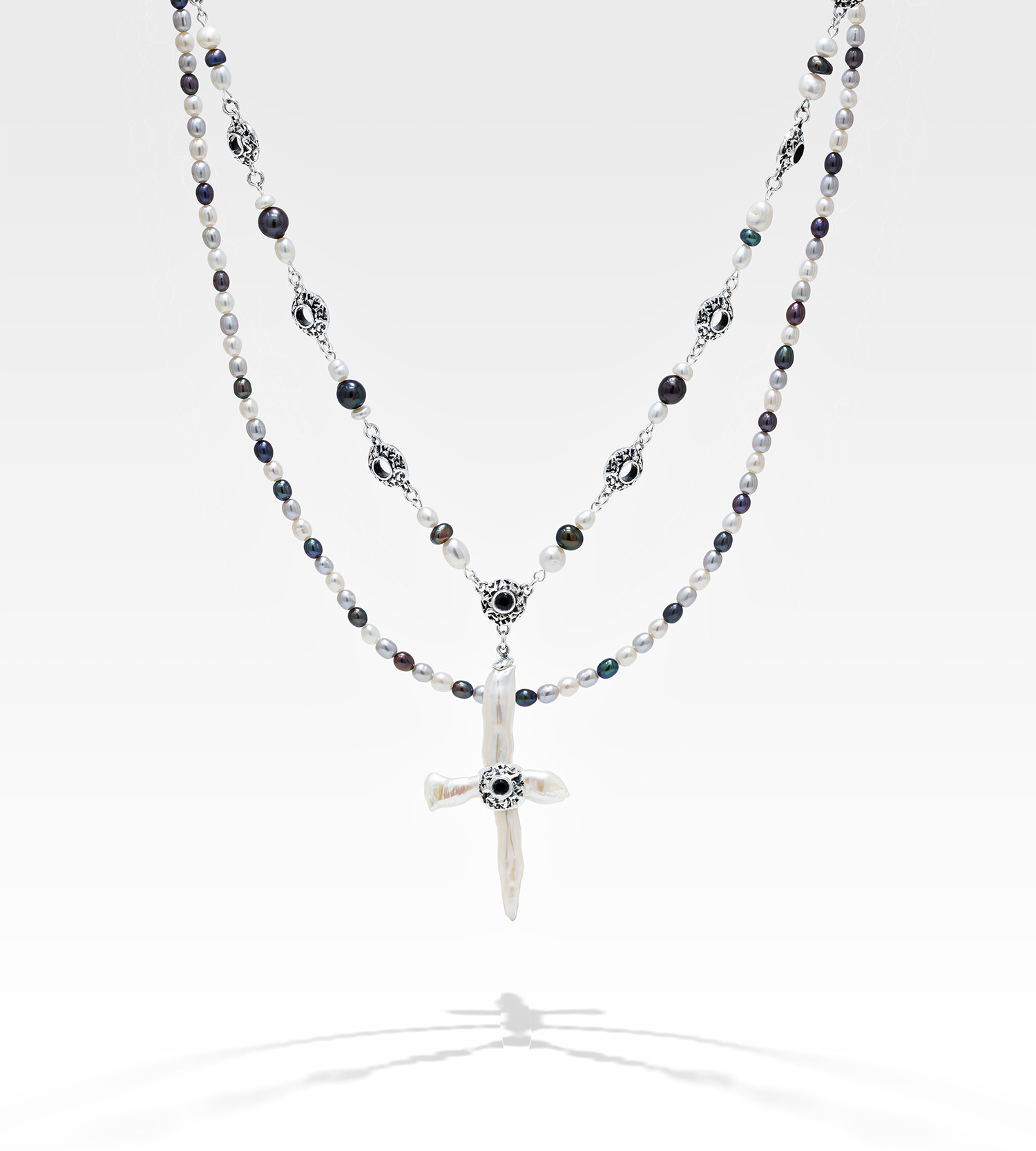 Freshwater cross pearl necklace with sterling silver and black sapphire accents.