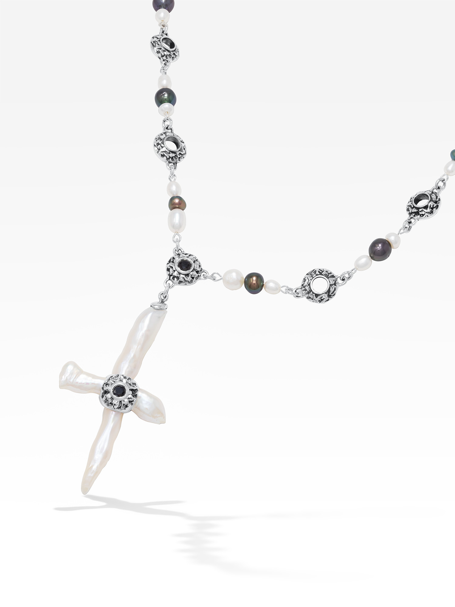 Freshwater cross pearl necklace with sterling silver and black sapphire accents.